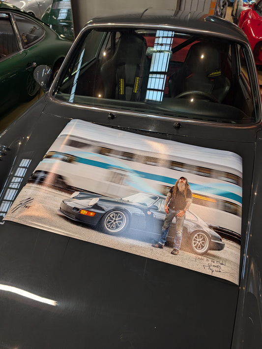 Signed by Magnus Walker and Larry Chen Porsche 964 with moving train as background